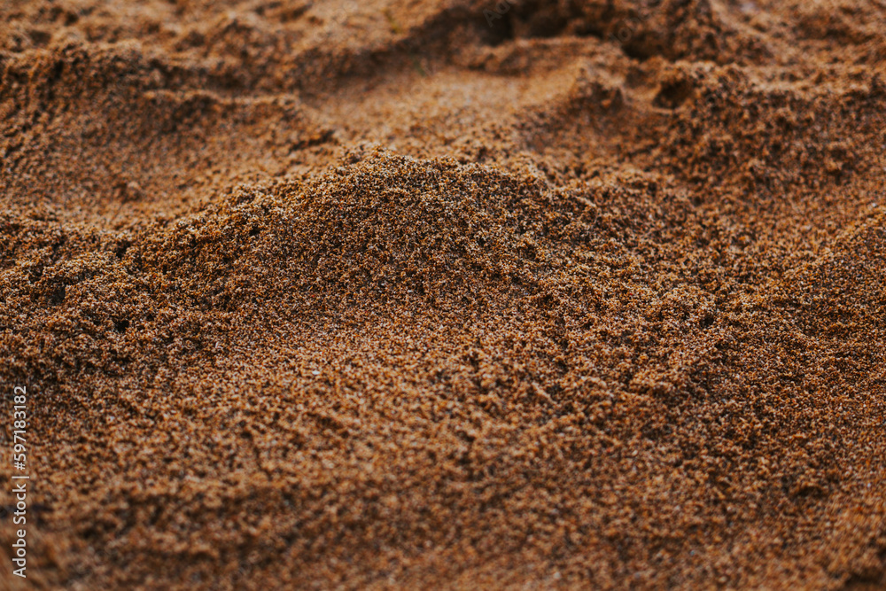 The texture of the sand close-up. Setting sun on the sand on the beach The texture of the sand close-up. Setting sun on the sand on the beach