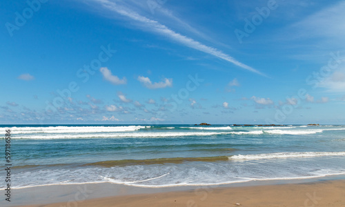 Nature landscape view of beautiful tropical beach and ocean in sunny day with blue sky.