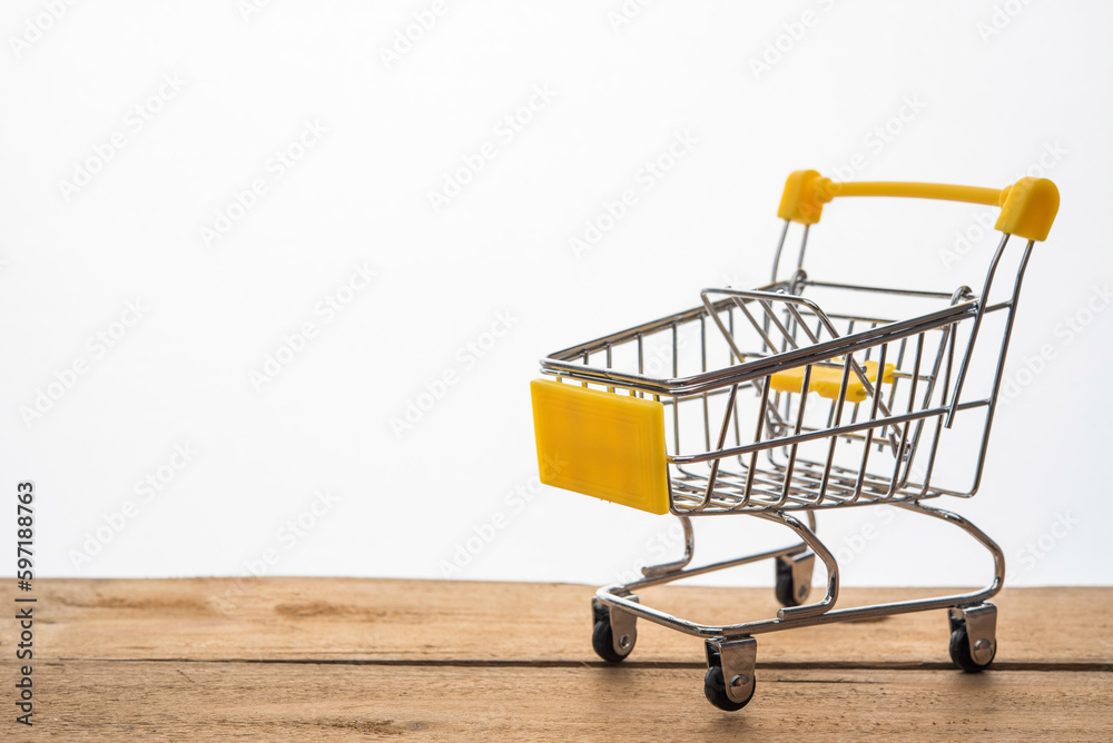 Mini shopping cart on table for work for work to shopping online concept