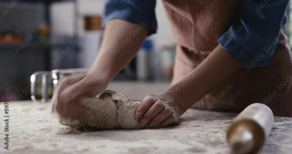 Woman hands kneading dough in the kitchen Woman hands kneading dough in the kitchen