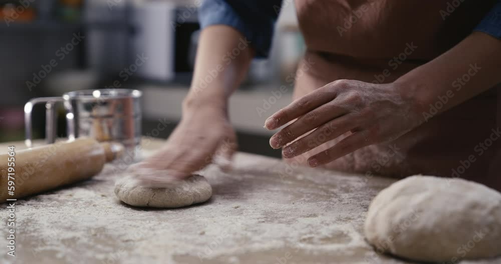 Woman hands kneading dough in the kitchen Woman hands kneading dough in the kitchen