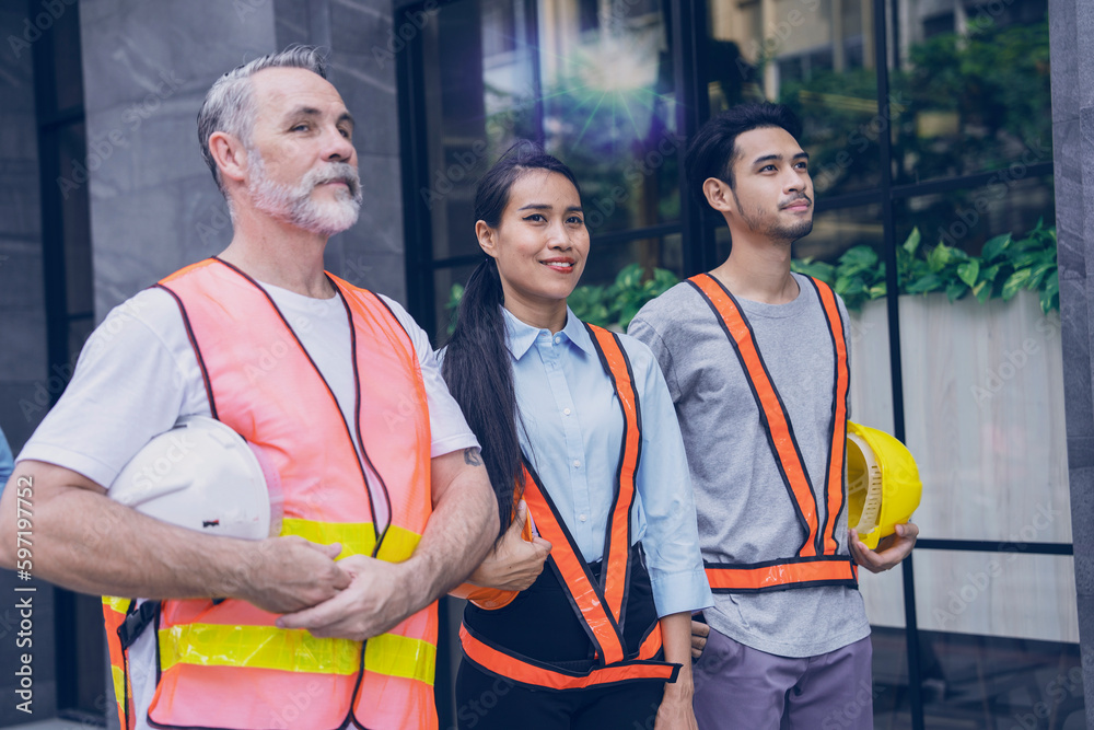 Two Asian male and female working teams wearing uniforms and holding