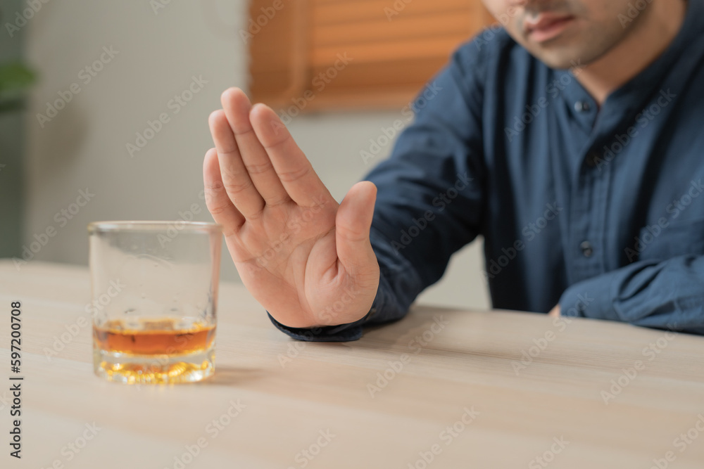 man refuses say no and avoid to drink an alcohol whiskey , stopping hand sign male, alcoholism treatment, alcohol addiction, quit booze, Stop Drinking Alcohol. Refuse Glass liquor, unhealthy, reject man refuses say no and avoid to drink an alcohol whiskey , stopping hand sign male, alcoholism treatment, alcohol addiction, quit booze, Stop Drinking Alcohol. Refuse Glass liquor, unhealthy, reject