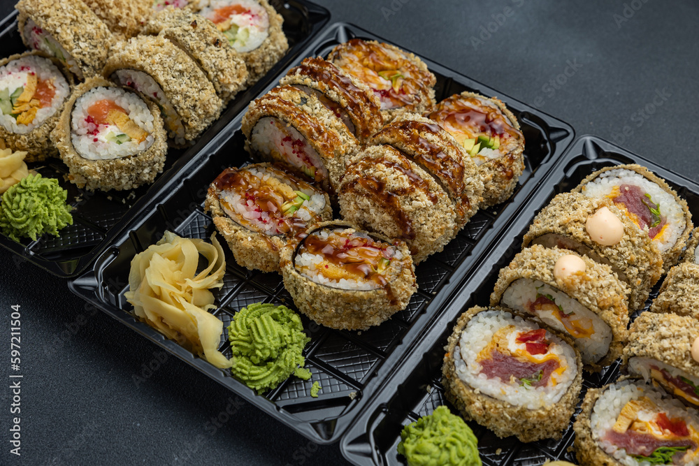 delicious japanese food from chef on black background. Delivery
delicious japanese food from chef on black background. Delivery