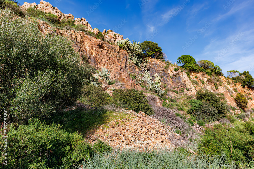 Obraz premium unusual rock formations of the volcanic cliff on Cala Sapone beach, quartz-trachitic ignimbrites.