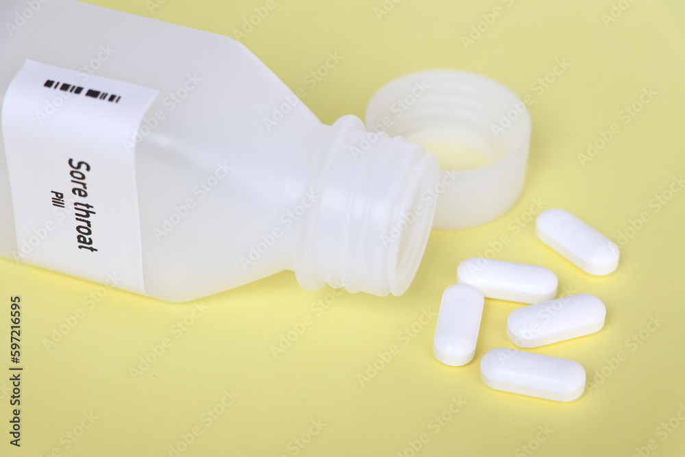 Sore throat pill in white bottle, pill stock Sore throat pill in white bottle, pill stock
