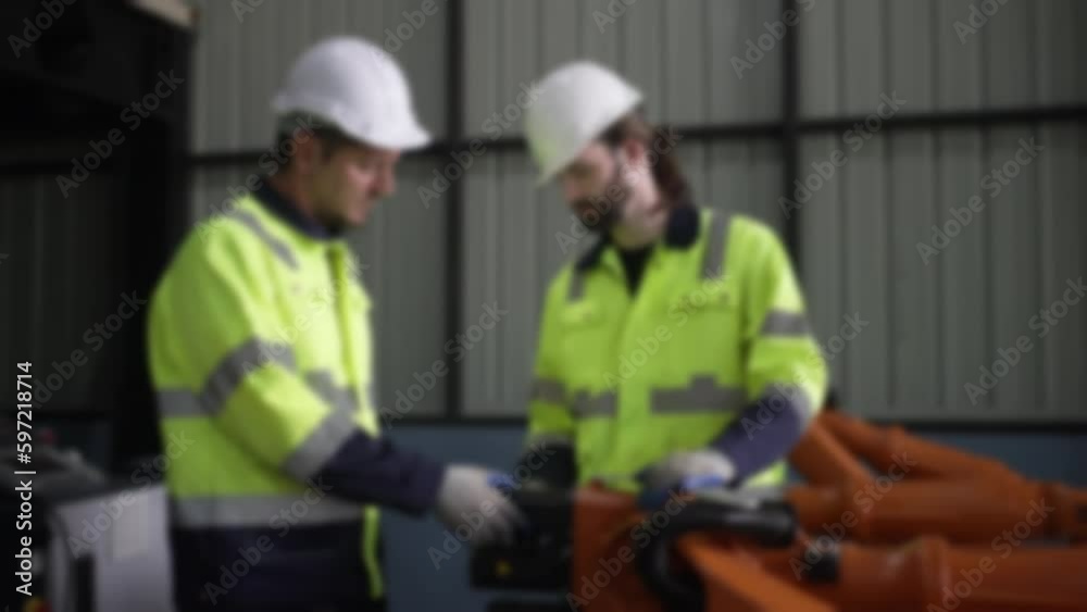 Engineer work at robotic arm factory. Engineer work at robotic arm factory.