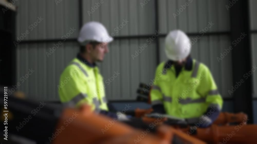 Engineer work at robotic arm factory. Engineer work at robotic arm factory.