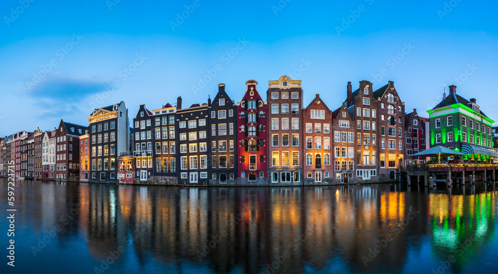 Typical Dutch houses in Amsterdam at dusk. Holland