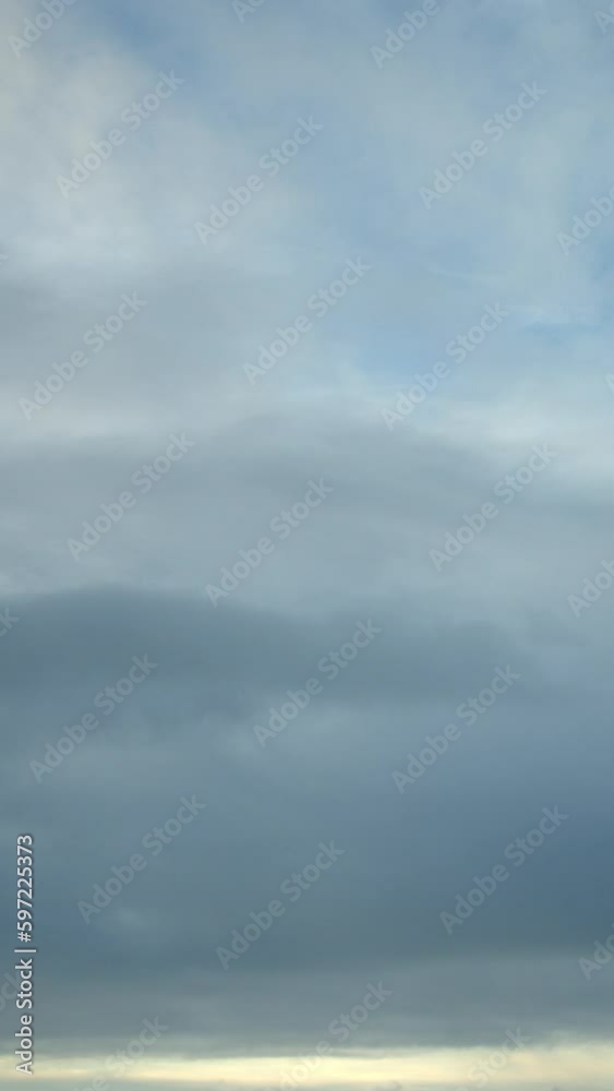 The morning sky is alive with a variety of clouds, each with its unique shape and texture. Vertical video. The morning sky is alive with a variety of clouds, each with its unique shape and texture. Vertical video.