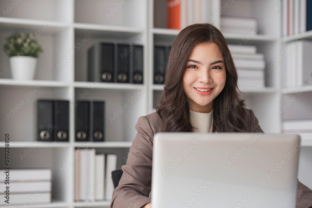 Business woman using calculator for do math finance on wooden desk in office and business working background, tax, accounting, statistics and analytic research concept.. Business woman using calculator for do math finance on wooden desk in office and business working background, tax, accounting, statistics and analytic research concept..