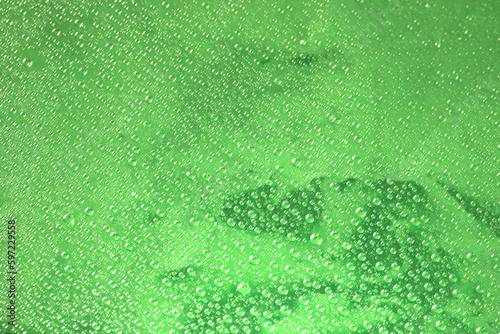 Green surface and water drops.