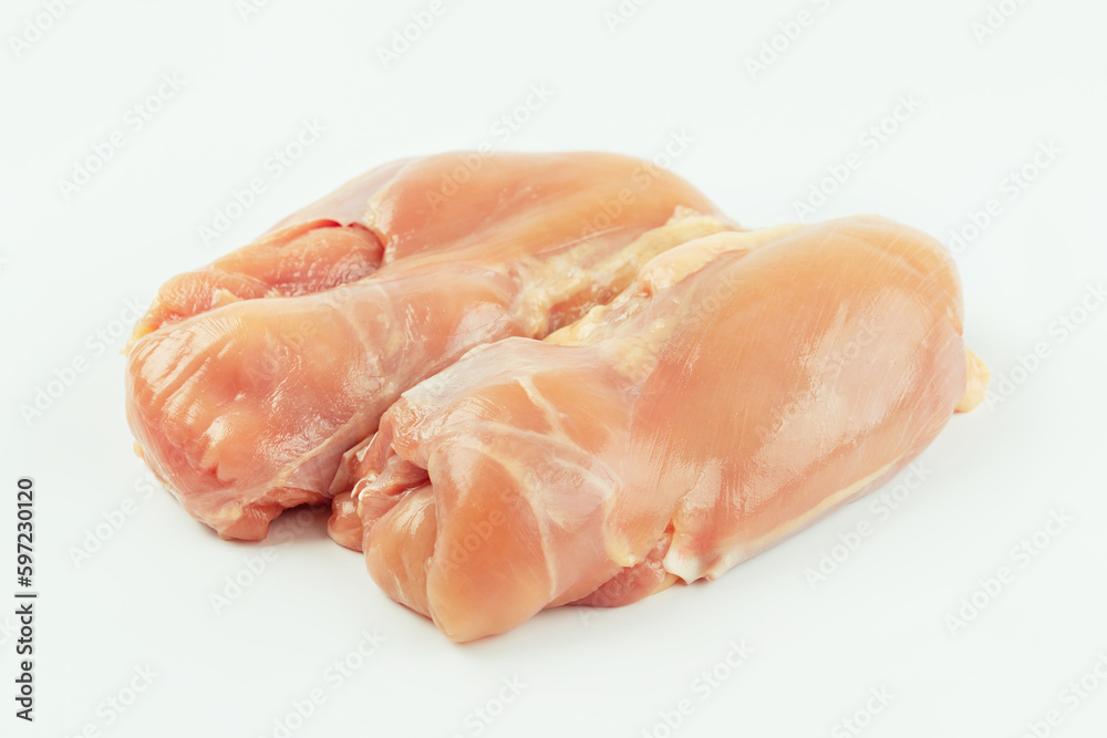 Skinless chicken meat.Raw fresh skinless chicken leg and thigh meat on a white background.Copy space.Food for retail.Ogranic food,healthy eating.Food concept.Top view.. Skinless chicken meat.Raw fresh skinless chicken leg and thigh meat on a white background.Copy space.Food for retail.Ogranic food,healthy eating.Food concept.Top view..