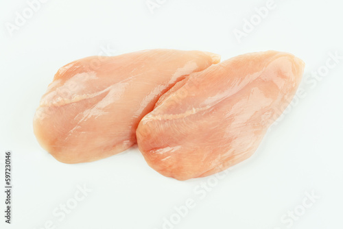 Raw fresh chicken fillet on a white background.Copy space.Raw Chicken breast Fillets.Food for retail.Procurement for designers.Ogranic food,healthy eating.Food concept.Top view.Close up.