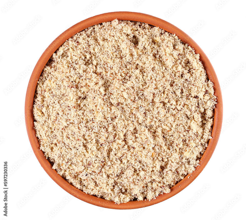 Hazelnuts ground pile in bowl isolated on white, top view Hazelnuts ground pile in bowl isolated on white, top view