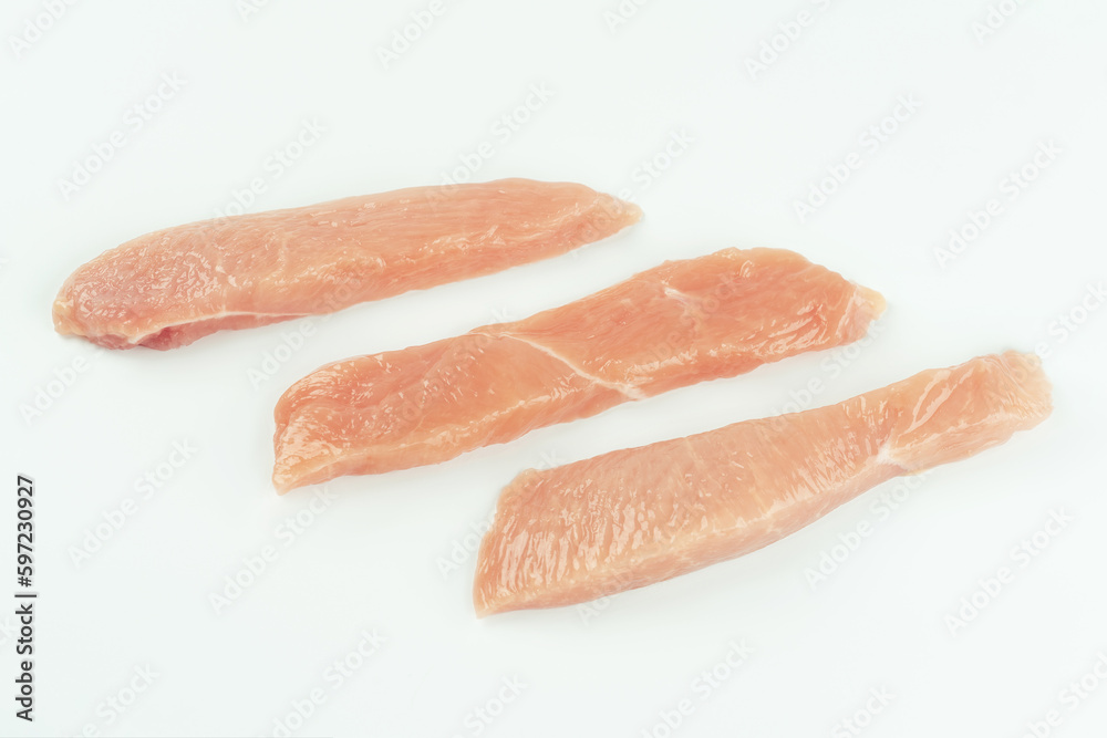Raw fresh chicken fillet on a white background.Copy space.Raw Chicken breast Fillets.Food for retail.Procurement for designers.Ogranic food,healthy eating.Food concept.Top view.Close up. Raw fresh chicken fillet on a white background.Copy space.Raw Chicken breast Fillets.Food for retail.Procurement for designers.Ogranic food,healthy eating.Food concept.Top view.Close up.