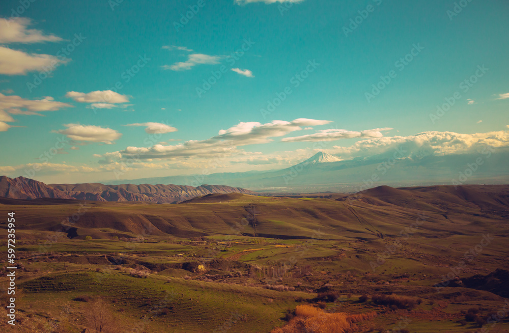 Toned beautiful Landscape in spring season in Armenia. Mountains, large valley. Sunny day outdoor. Nature in the hills	