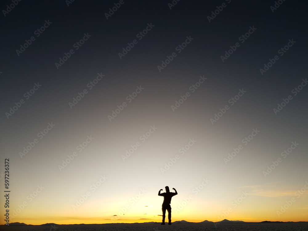 silhouette of a person on a sunset background