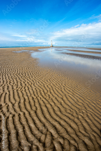 Cordouan lighthouse in the distance during the low tide in the Gironde estuary in France