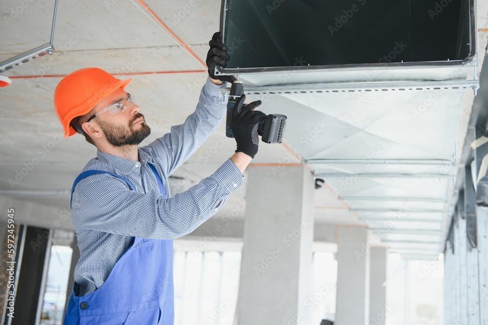 hvac engineer install heat recovery ventilation system for new house. copy space hvac engineer install heat recovery ventilation system for new house. copy space