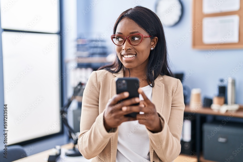 Young african american woman business worker using smartphone at office Young african american woman business worker using smartphone at office