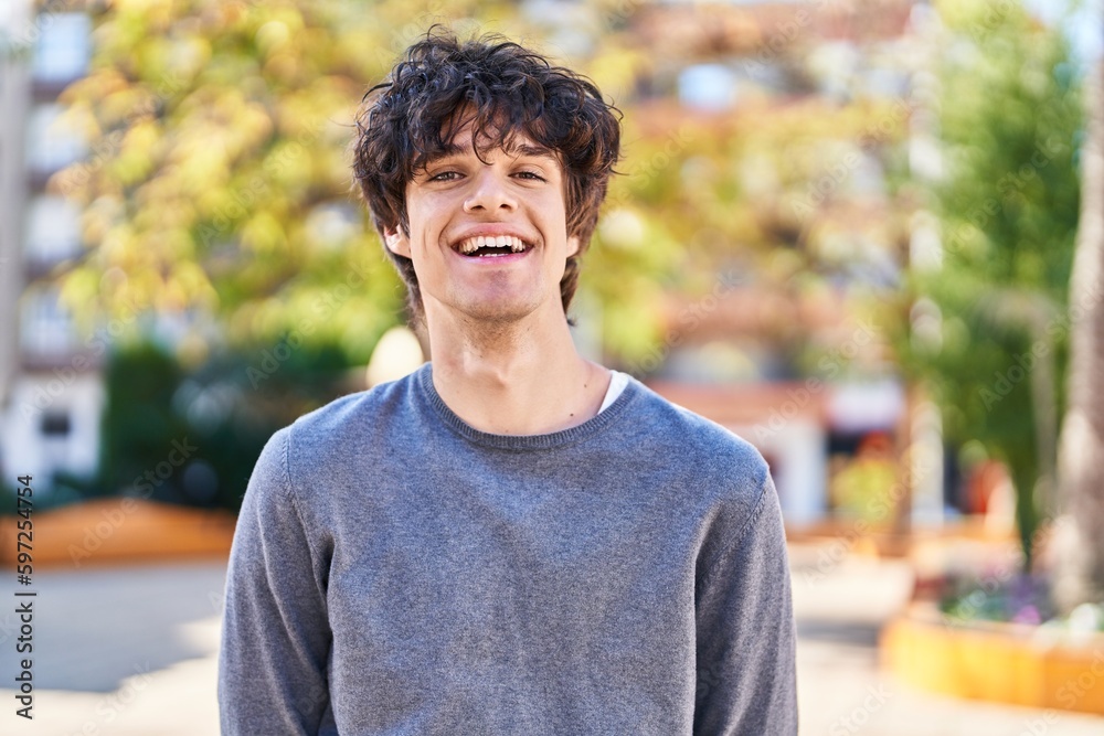 Young hispanic man smiling confident standing at park Young hispanic man smiling confident standing at park