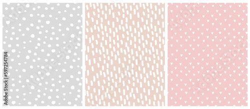Abstract Hand Drawn Geometric Vector Patterns. White Spots,Lines and Hearts Isolated on a Pink, Gray and Beige Background. Irregular Geometric Repeatable Vector Print ideal for Fabric,Wrapping Paper.