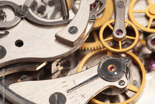 Mechanism, clockwork of a watch close-up. Vintage luxury background. Time, work concept