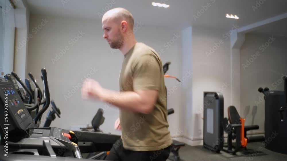 Man running in the gym on a treadmill concept for sports, fitness. Man running in the gym on a treadmill concept for sports, fitness.