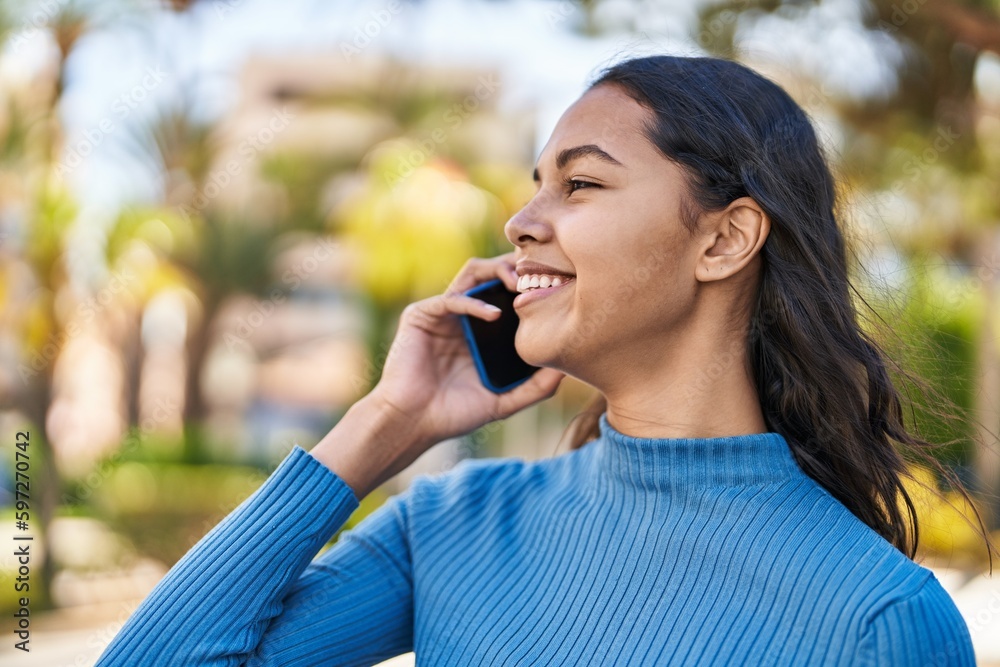 Young african american woman smiling confident talking on the smartphone at park Young african american woman smiling confident talking on the smartphone at park