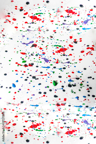 Multicolored splashes of gouache paint drops  