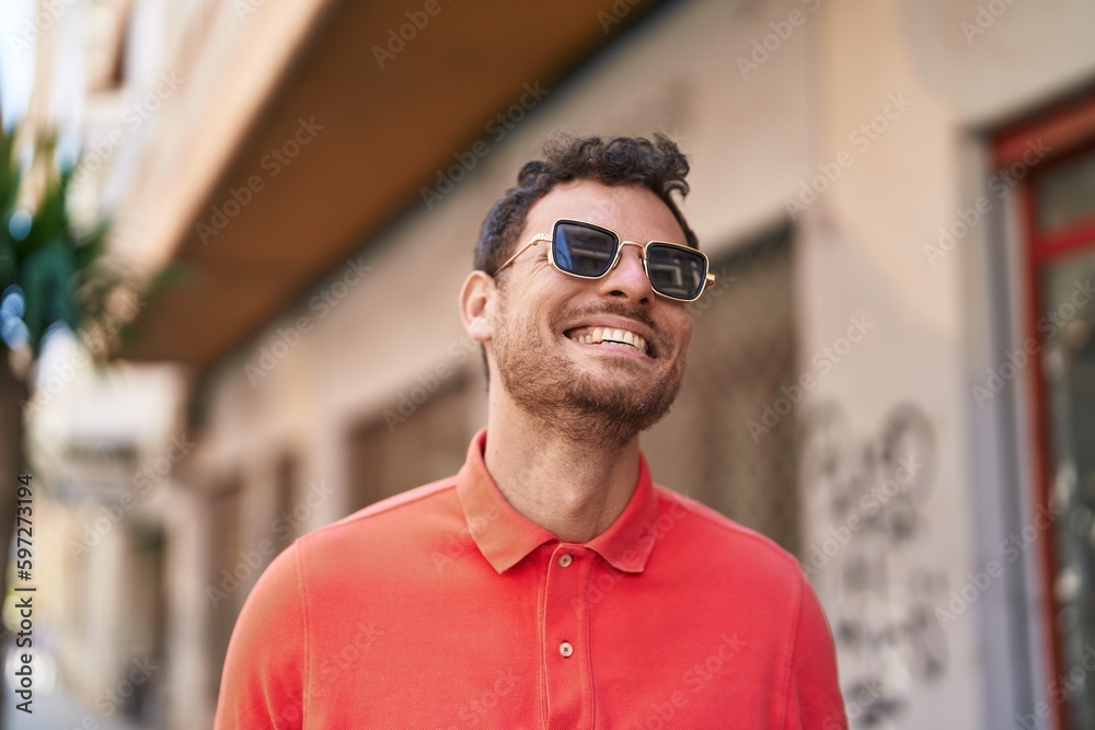 Young hispanic man smiling confident wearing sunglasses at street Young hispanic man smiling confident wearing sunglasses at street