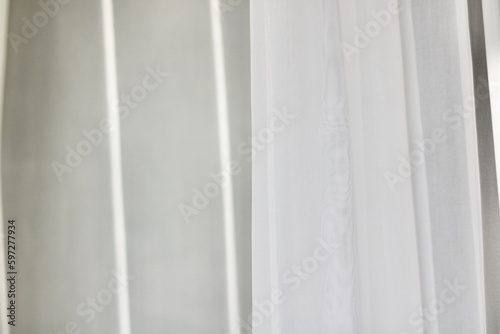 Voile curtain in front of window with space for copy