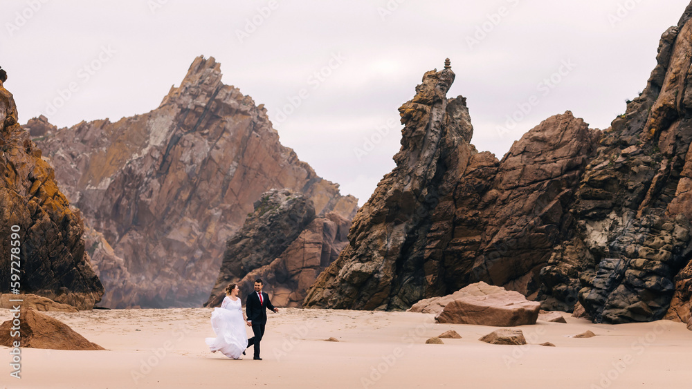 newlyweds having fun and walking on the background of massive st