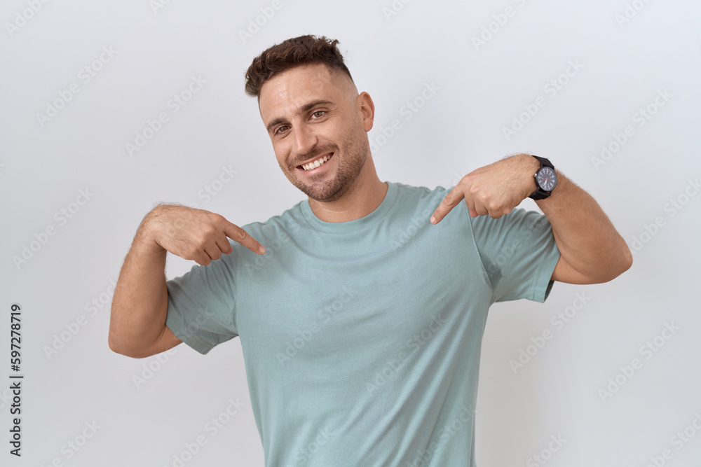 Hispanic man with beard standing over white background looking confident with smile on face, pointing oneself with fingers proud and happy. Hispanic man with beard standing over white background looking confident with smile on face, pointing oneself with fingers proud and happy.