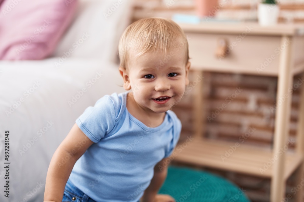 Adorable toddler smiling confident standing at bedroom Adorable toddler smiling confident standing at bedroom