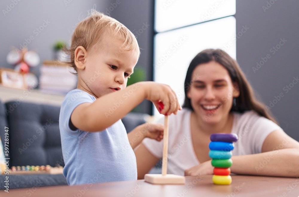 Mother and son smiling confident playing at home Mother and son smiling confident playing at home