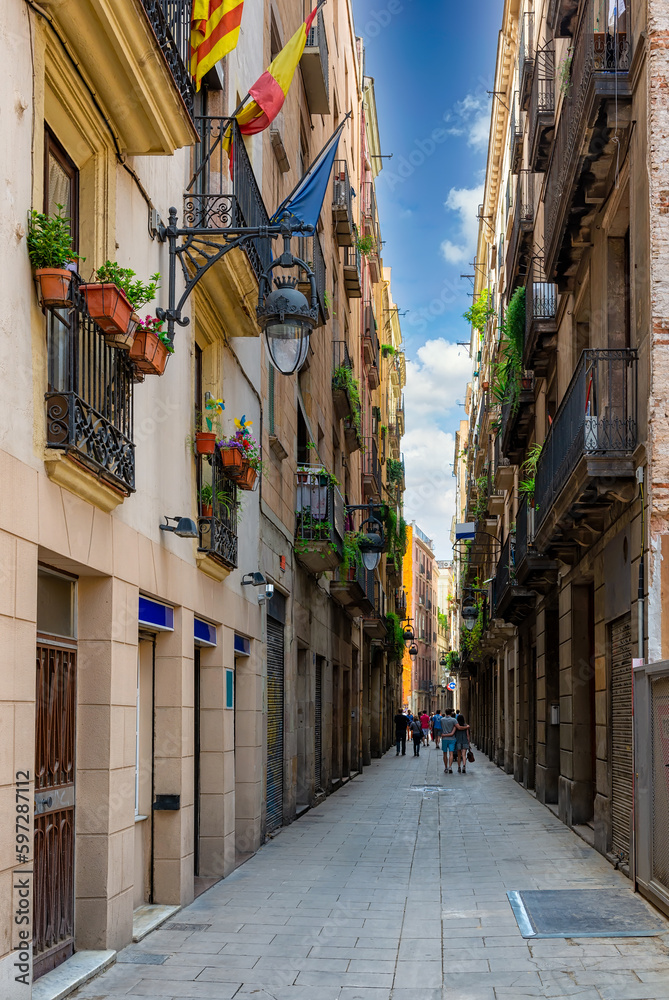 Old narrow street in Barcelona, Catalonia, Spain. Architecture and landmark of Barcelona. Cozy cityscape of Barcelona