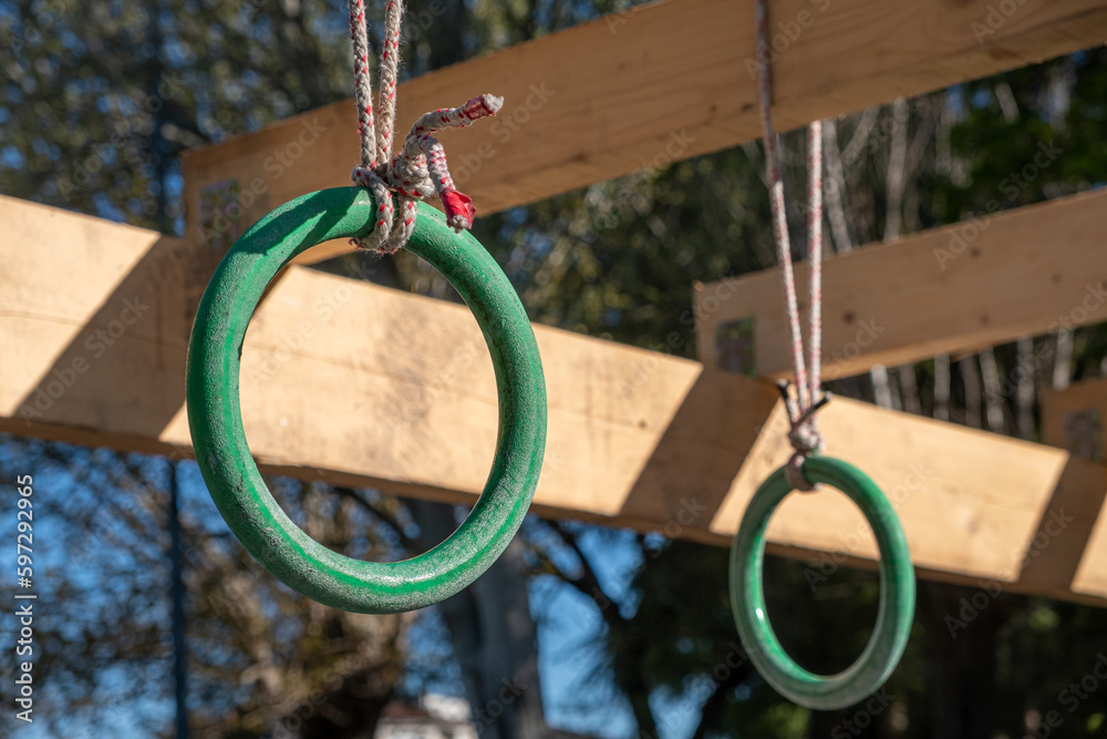 selective focus. detail of the rings of one of the obstacles of an obstacle course, ocr