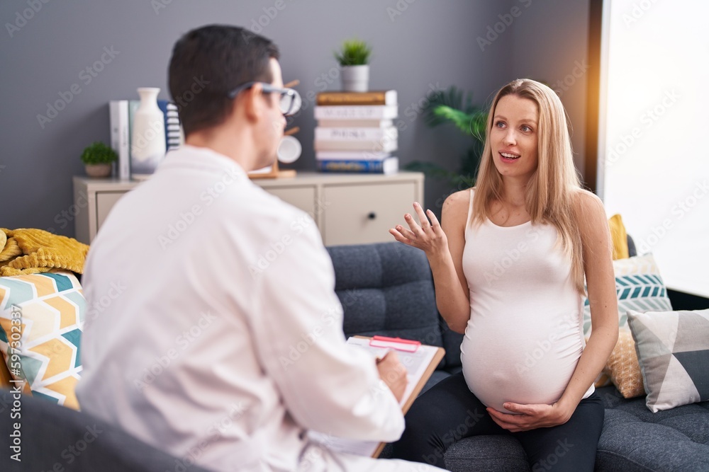 Man and woman doctor and pregnant patient having medical consultation at home Man and woman doctor and pregnant patient having medical consultation at home