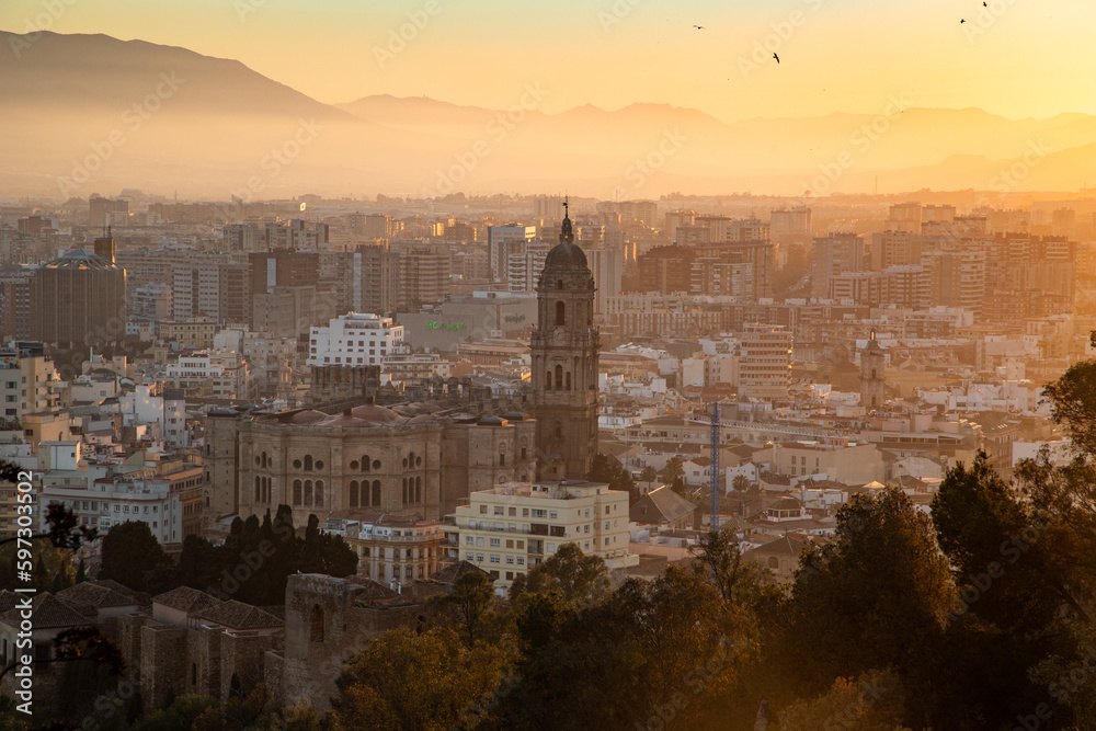 Fototapeta premium view over Malaga at sunset travel banner