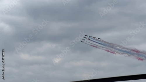 Aerial display team trailing smoke at an airshow