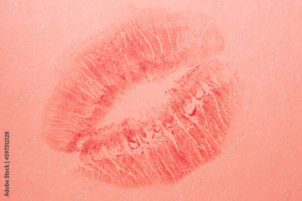 Red lipstick imprints on pink paper, kiss, beautiful red lips Red lipstick imprints on pink paper, kiss, beautiful red lips