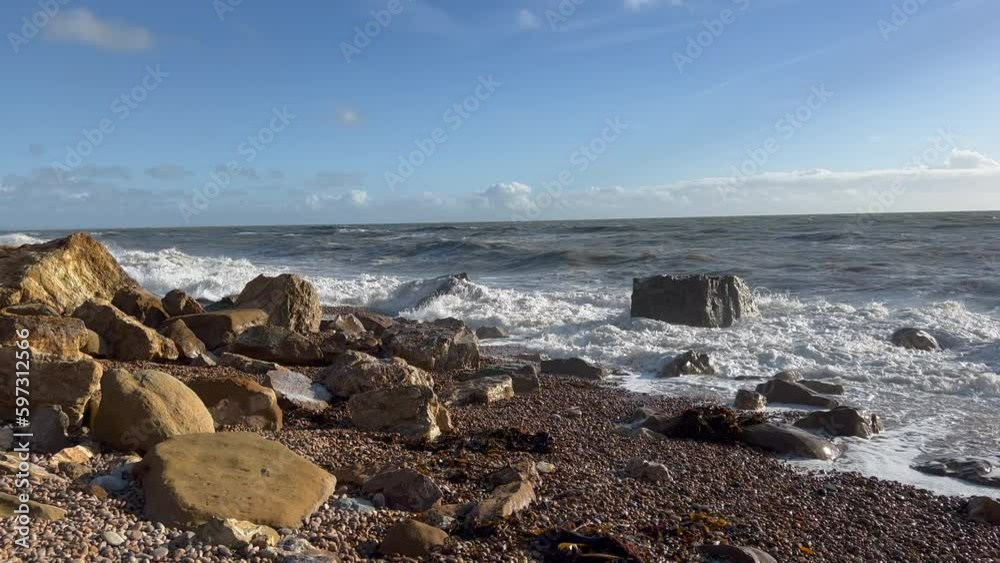 Waves breaking on a stone beach Waves breaking on a stone beach