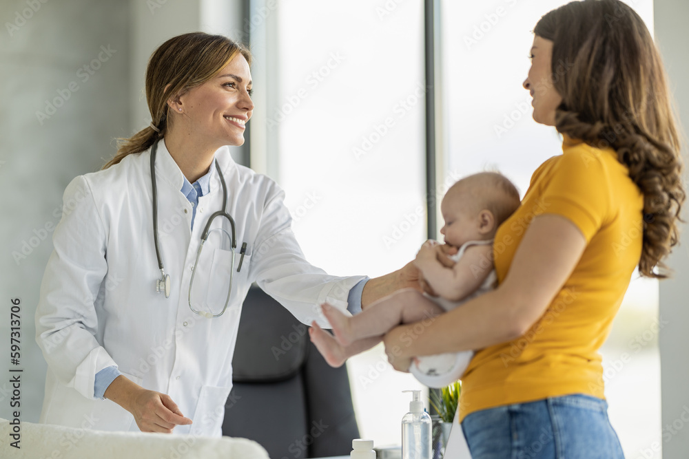 Pediatrician doctor medical examining little smiling baby