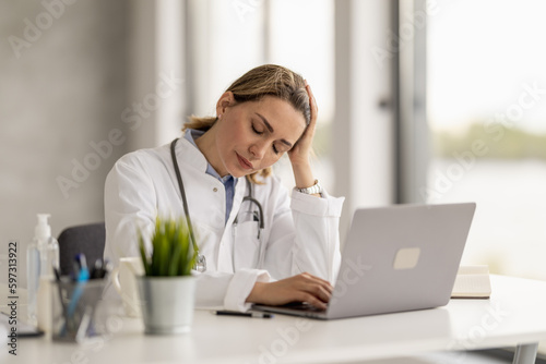 Portrait of female doctor talking to online patient at clinic office giving online consultation for domestic health treatment