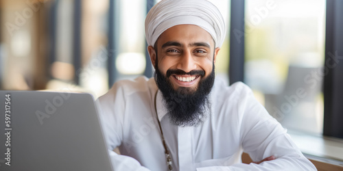 Successful muslim businessman in traditional white Kandura uses laptop in his modern office. Successful Saudi, Emirati, Arab businessman. digital ai art
 photo