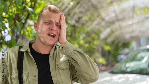 Sad caucasian man with hearing aids outdoors. © Михаил Решетников