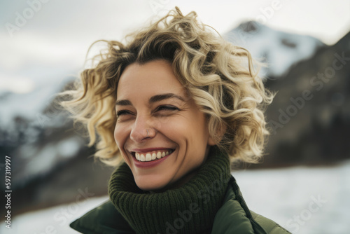 Radiant woman with curly blonde hair and a bright smile wearing an army green turtleneck against a snowy mountain backdrop, generative ai © aicandy