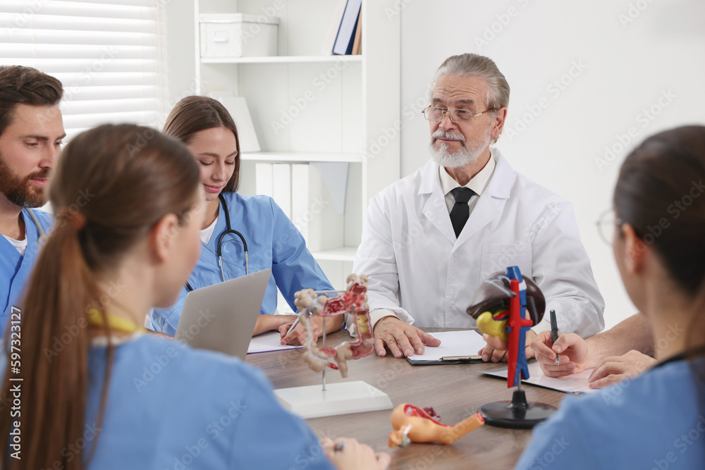 Doctor and interns on lecture in university